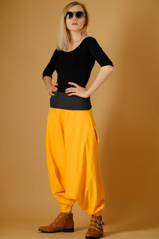 Haremki damskie mandarynkowe z obniżonym krokiem – idealne na jogę